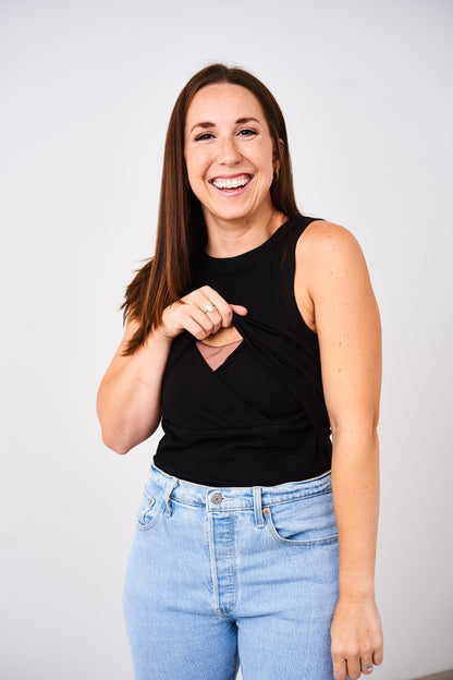 Woman showing the lift up v-neck nursing access of the Latched Mama high neck nursing ribbed tank.