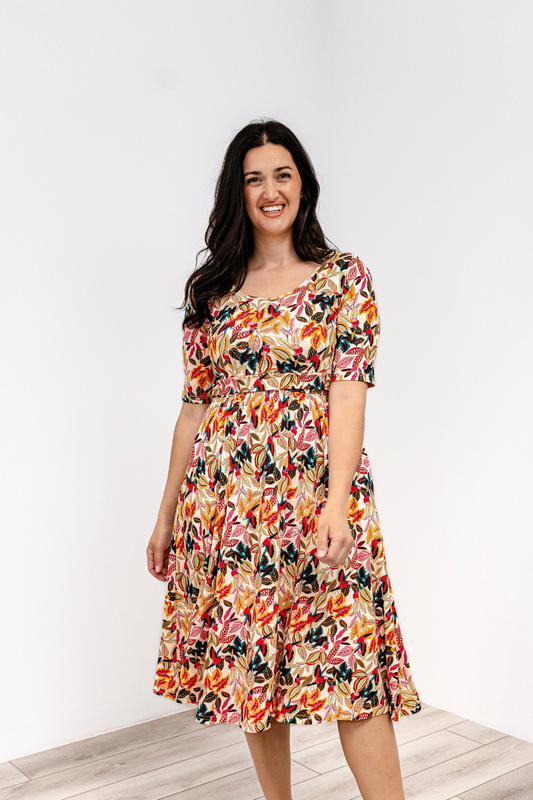 Woman wearing a colorful latched mama classic cotton nursing dress