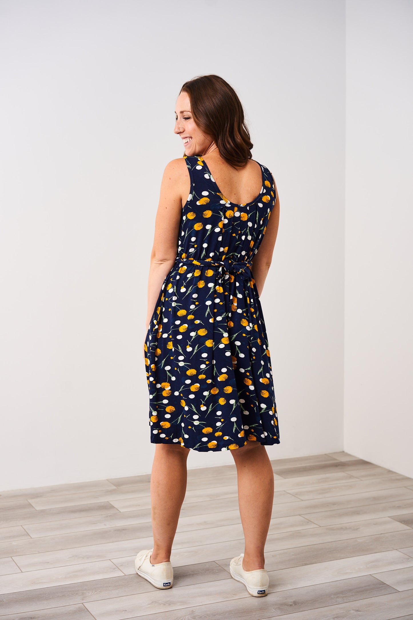 Back view of the Latched Mama Momper dandelion print nursing romper