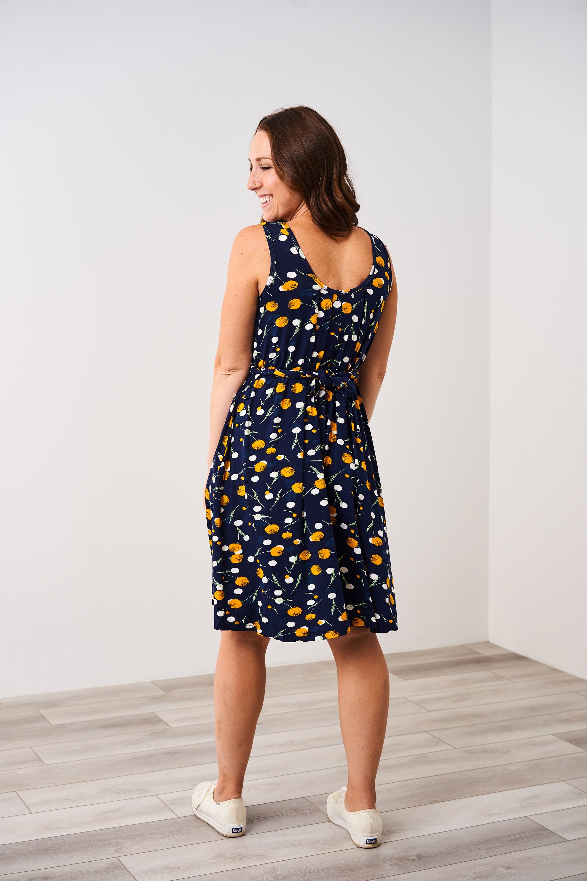 Back view of the Latched Mama Momper dandelion print nursing romper