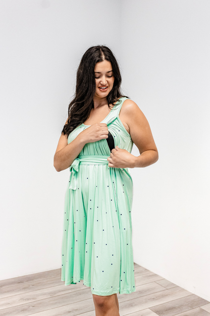 Woman showing the side nursing access on the Latched Mama nursing romper momper.