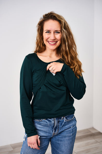 Woman wearing a long sleeve green latched mama nursing shirt