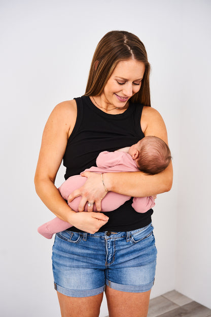 Woman nursing a baby in a Latched Mama high neck nursing tank.