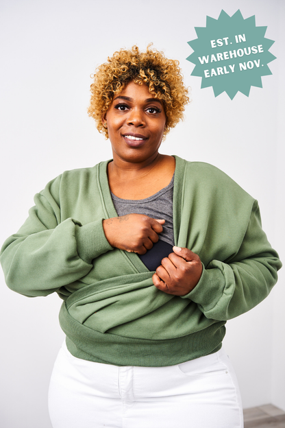 Woman wearing a green sweater with a white background and promotional text overlay.