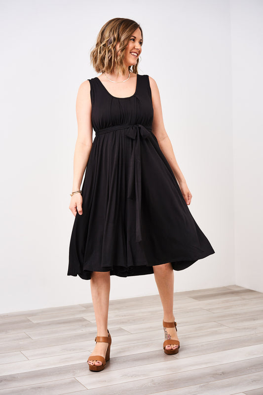 Woman wearing a latched mama romper in black