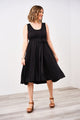 Woman wearing a latched mama romper in black