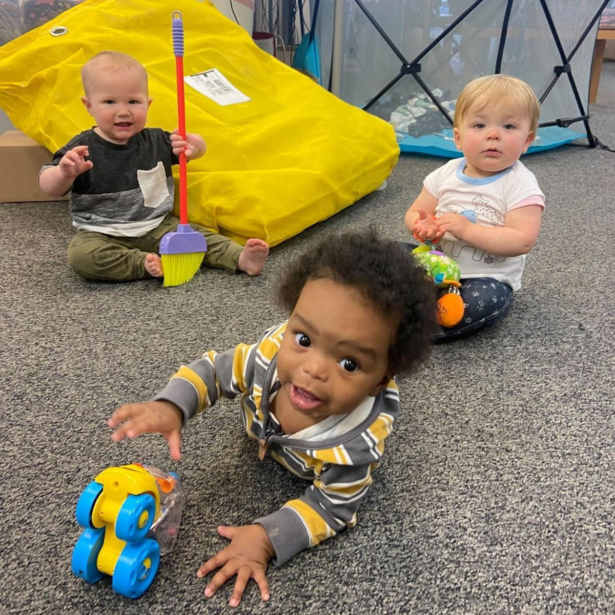 Babies playing together at the former Latched Mama workplace